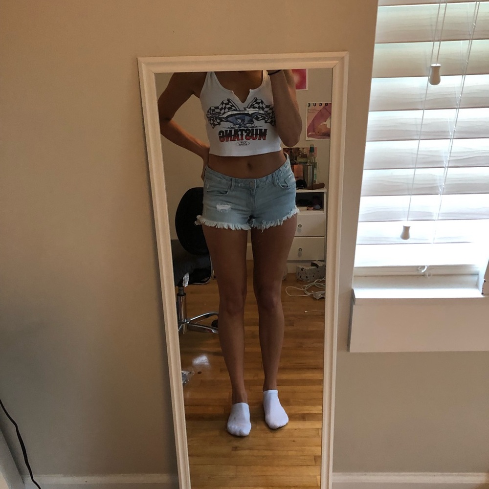 Blue denim distressed shorts from Forever 21. Size 28”